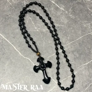 Black Onyx Cross Pendant Necklace laid flat – main product image