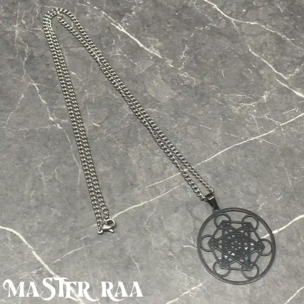 Gun metal sacred geometry pendant laid flat – dark-toned metaphysical jewelry