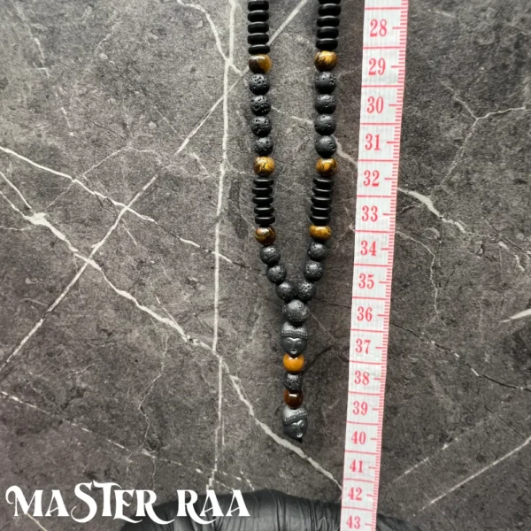 Tigers Eye Buddha Pendant Necklace with ruler for size reference