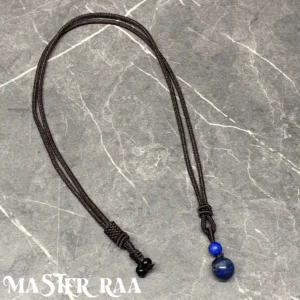 Lapis Lazuli pendant necklace laid flat showing deep blue and golden flecks – Master Raa