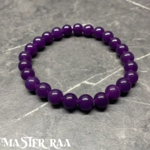 Amethyst healing crystal bracelet with polished round beads, laid flat on white background